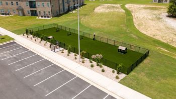 Leash-free bark park with agility equipment